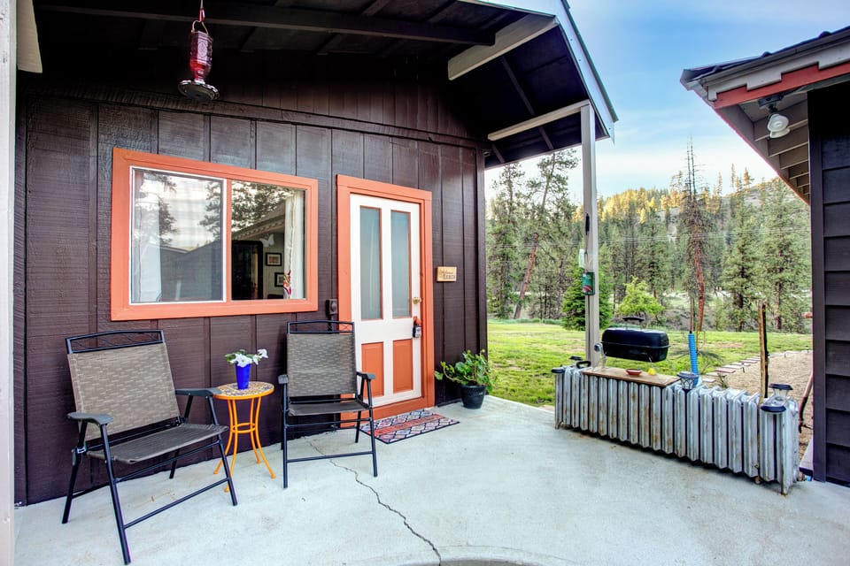View of front porch of your bungalow w/ table & chairs and grill.