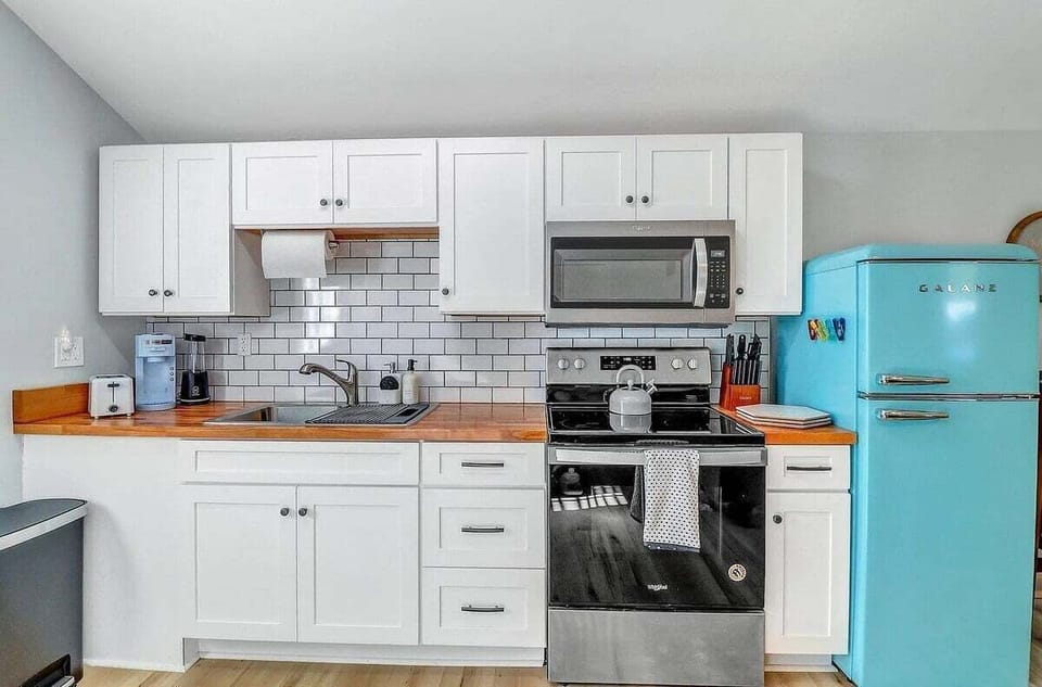 Whip up something special in this charming kitchenette—small in size but big on character and fully equipped for your culinary needs!