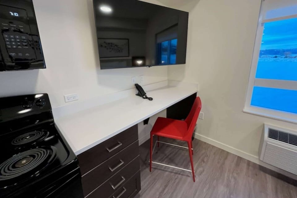 Desk, laptop workspace, blackout drapes, WiFi