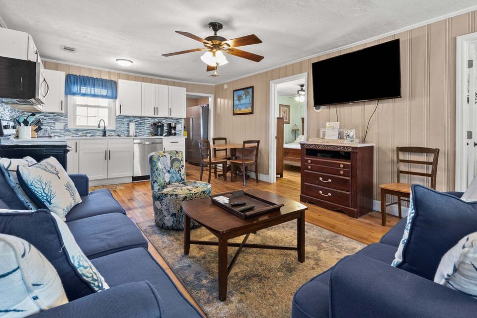 Open living, dining and kitchen space at Rising Tide, an 8-bedroom Cherry Grove home in North Myrtle Beach