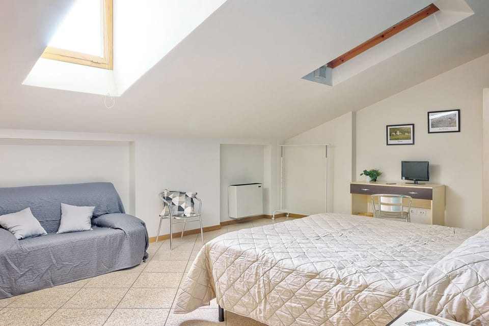 Triple Room | Desk, laptop workspace, blackout drapes, free WiFi