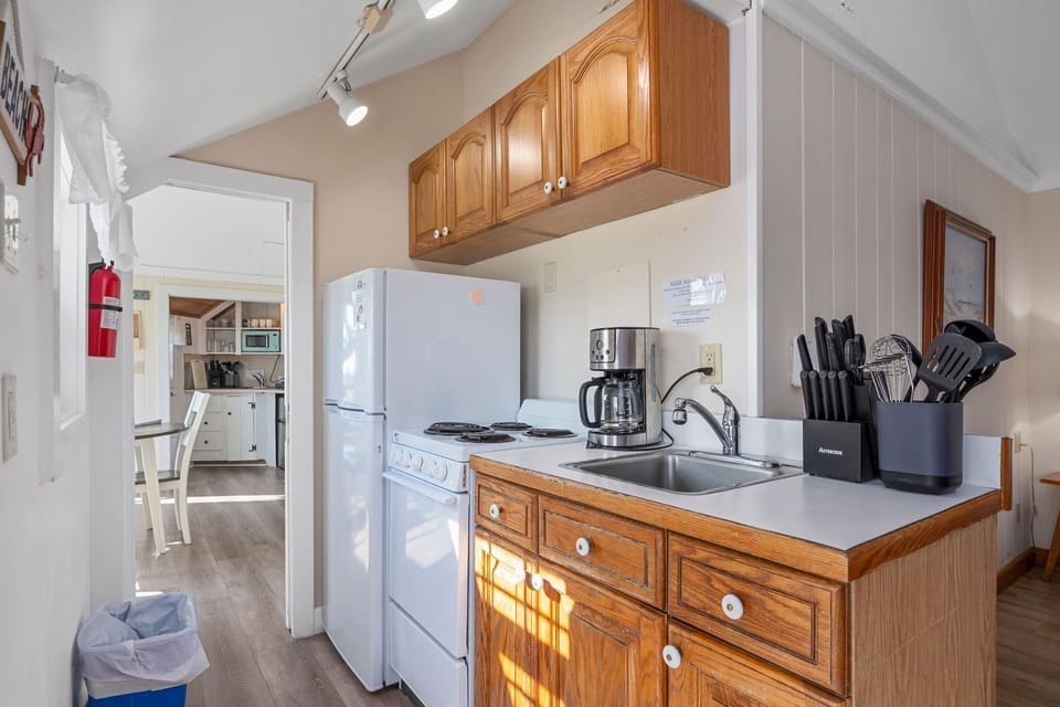 Kitchen with full size fridge, stove/oven
