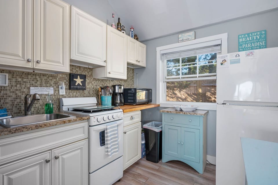 Kitchen #! with a stove and fridge