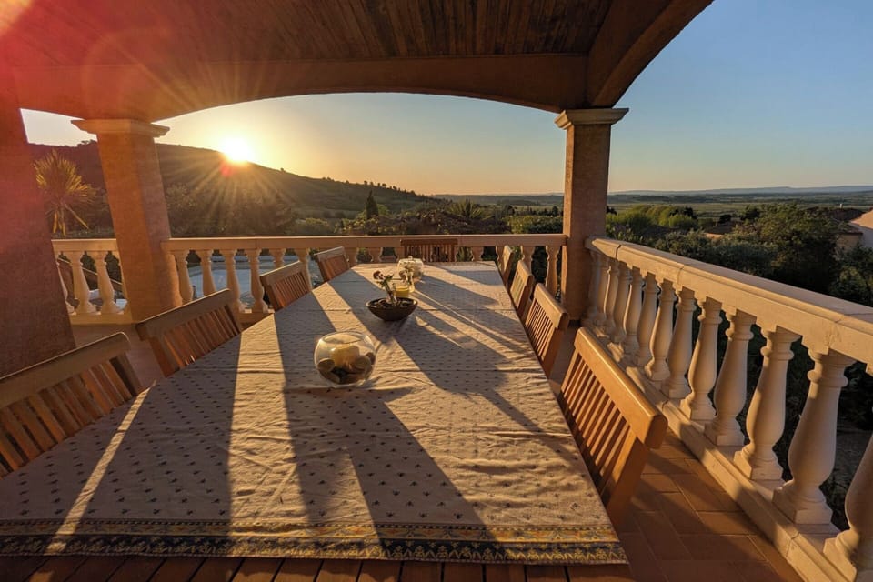Terrace dining with panoramic views. Sunrise in May.