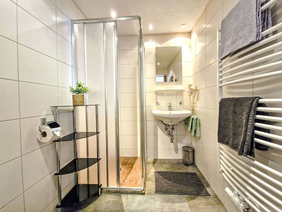 Flooring, Interior Design, Floor, Plumbing Fixture, Bathroom, Toilet, Room, Plumbing, Tile, Ceiling