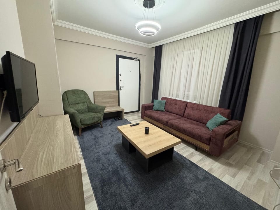 Deluxe Double Room, Balcony, City View | Living area | 82-inch LED TV with satellite channels