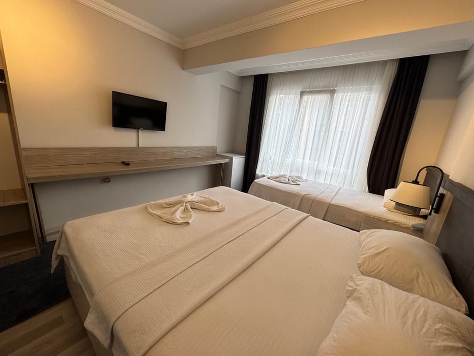 Triple Room, Balcony, City View | Laptop workspace, free WiFi