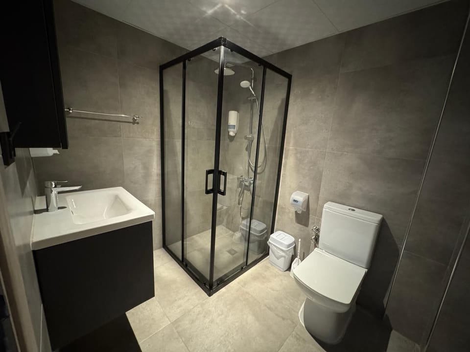 Triple Room, Balcony, City View | Bathroom | Shower, hair dryer, towels, soap