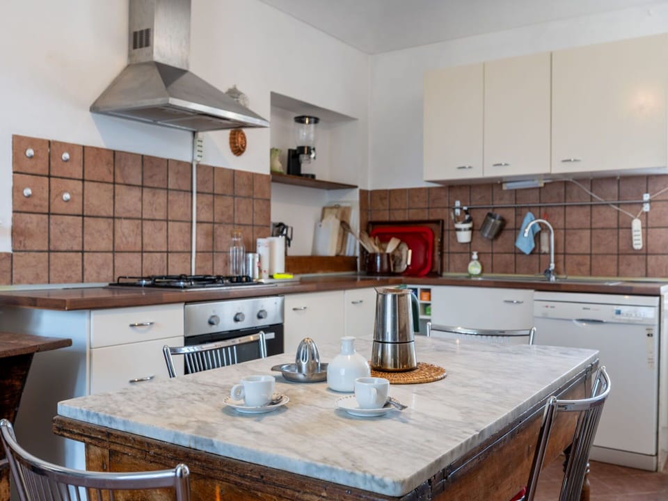 Kitchen, Countertop, Kitchen Appliance, Furniture, Cabinetry, Flooring, Major Appliance, Interior Design, Home Appliance, Floor