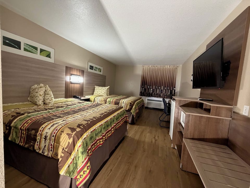 Standard Room, 2 Queen Beds, Non Smoking | In-room safe, desk, blackout drapes, iron/ironing board