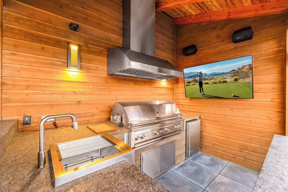 Fully Equipped Outdoor Kitchen with 54" Lynx Infrared BBQ, Sink, Mini Fridge, Ice Maker & 65" TV