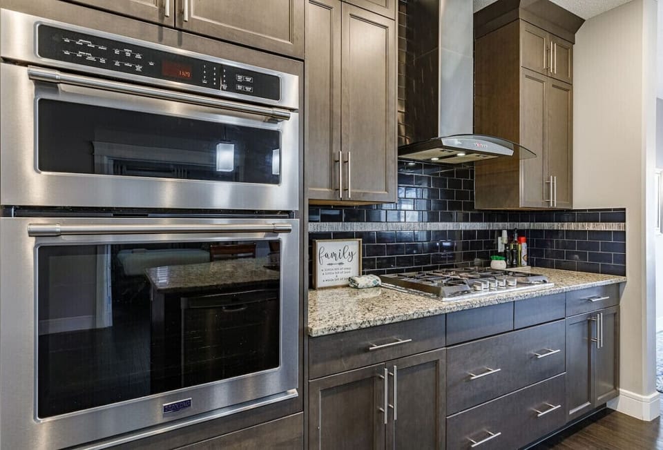 The spacious kitchen includes modern appliances and cookware. Perfect for families or longer stays.