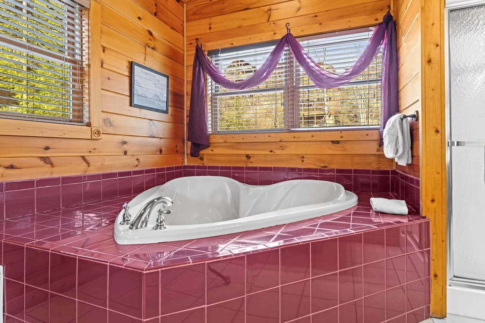 Shared bathroom with separate shower and tub