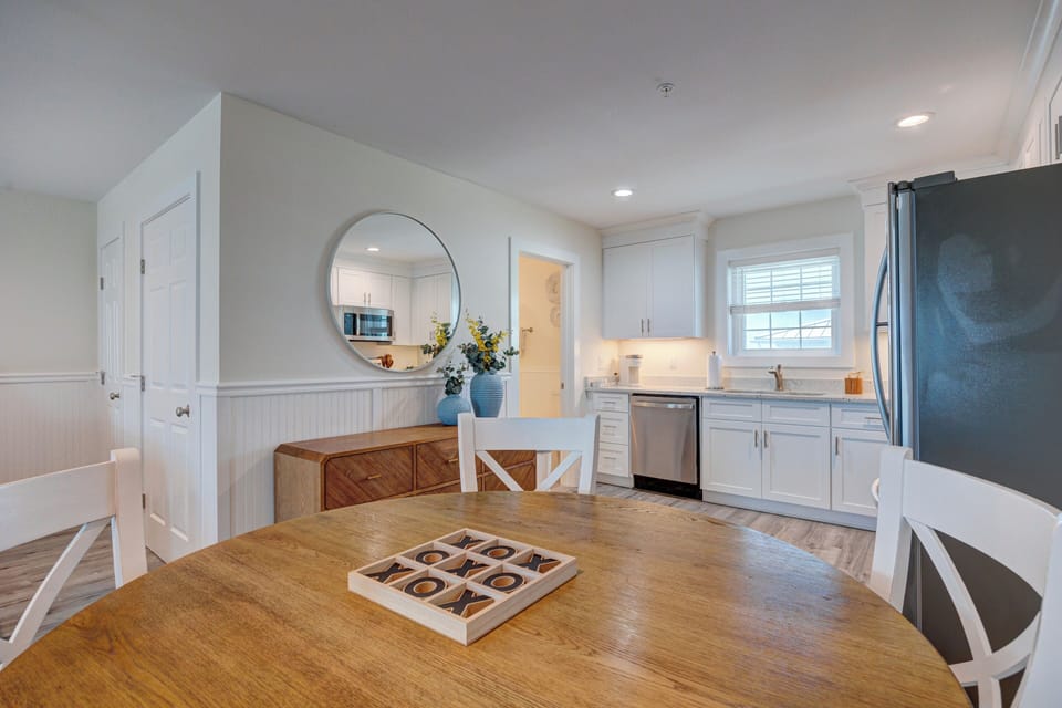 Your bright dining area flows into a fully equipped kitchen with modern appliances, perfect for preparing memorable meals together.