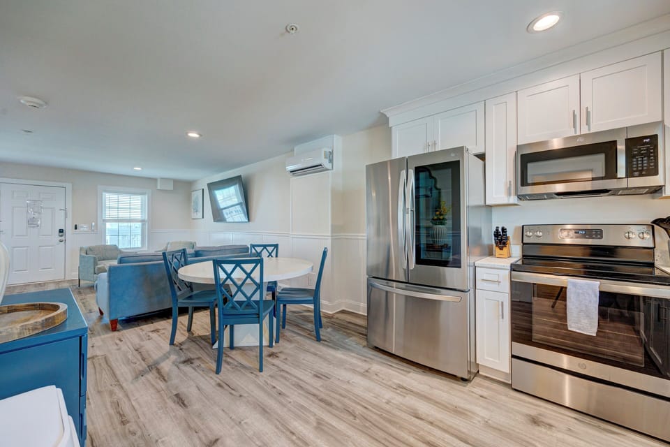 Your bright, coastal-inspired kitchen features modern appliances and a charming dining nook where you'll love sharing meals together.
