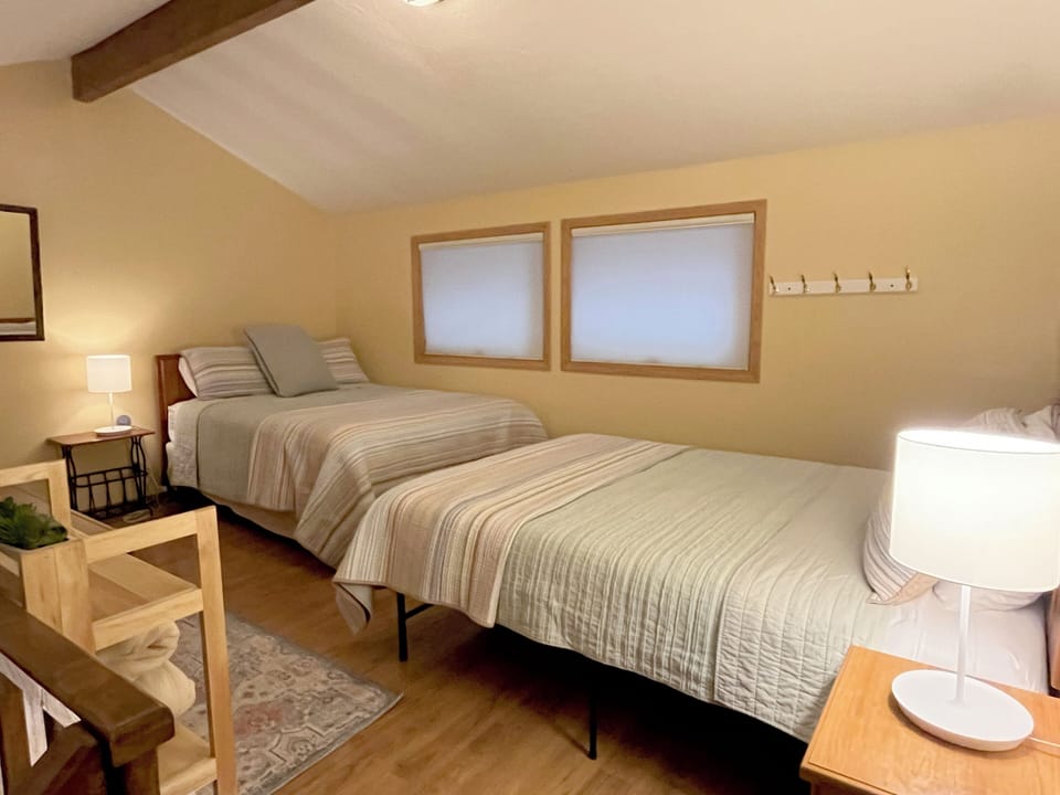Loft sleeping space, two queen beds, storage