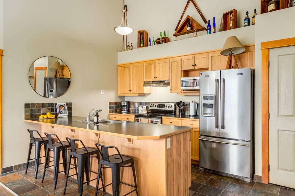 Full kitchen with all essentials such as coffee maker, stove, fridge, microwave, kitchen utensils, etc.