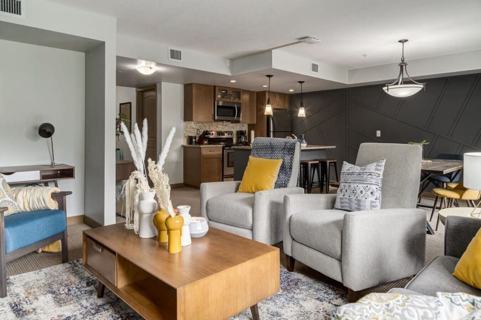 Living area, dining table and kitchen.