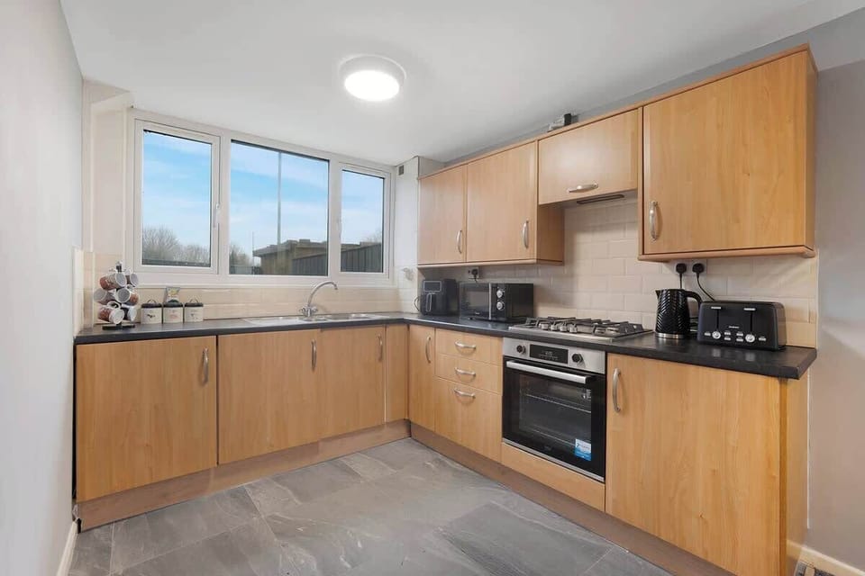 Family-friendly kitchen oasis equipped with all essentials, including a washer & dryer, oven, fridge and full cookware set. 