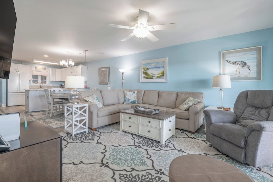 A super cozy living space with plenty of room to stretch out, hang out, and enjoy the beach vibes