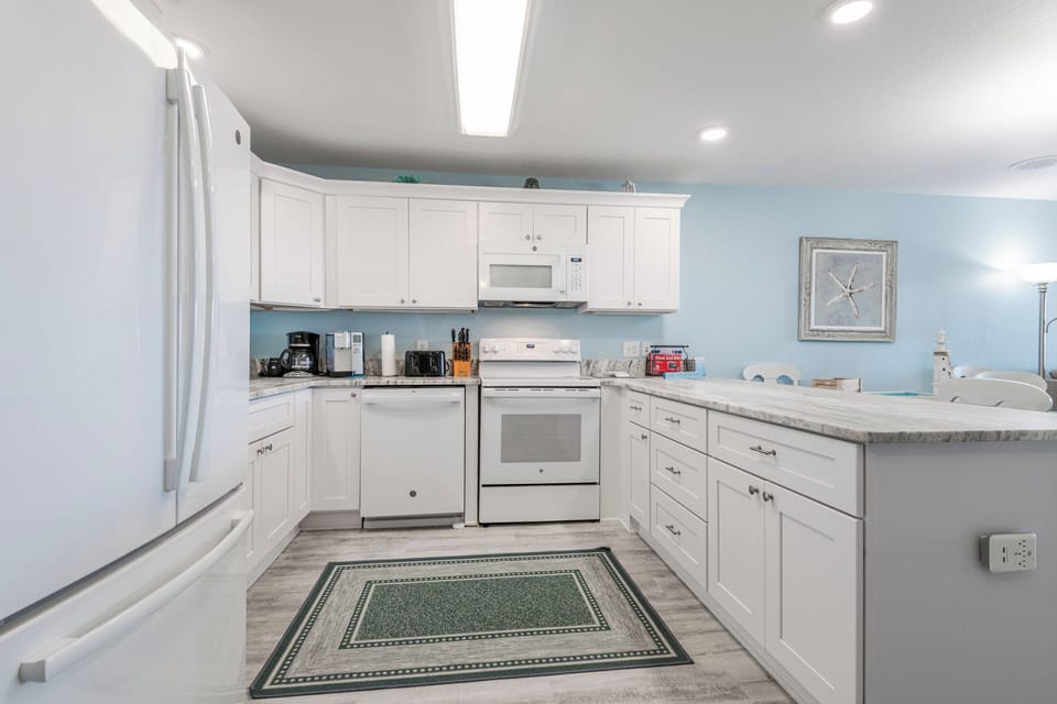 A bright and airy kitchen with plenty of counter space, perfect for cooking up vacation meals