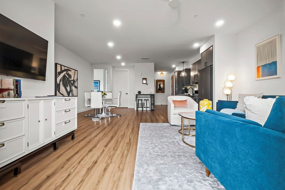 Deluxe Condo, 2 Bedrooms, Balcony, City View | Living area | 55-inch Smart TV with digital channels, Netflix, table tennis