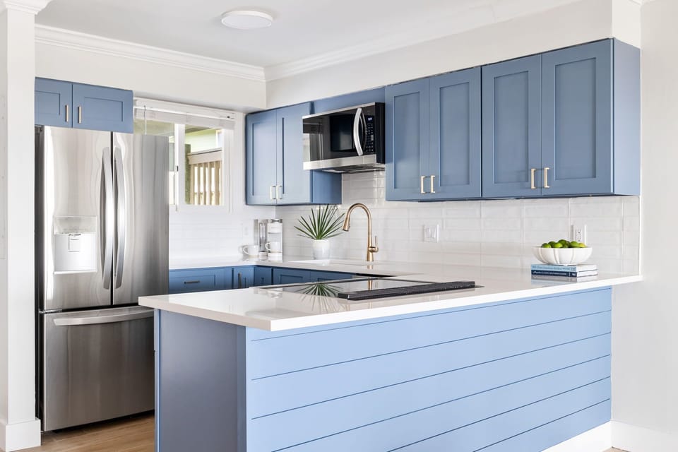 Modern, fully equipped kitchen with new appliances and quartz countertops