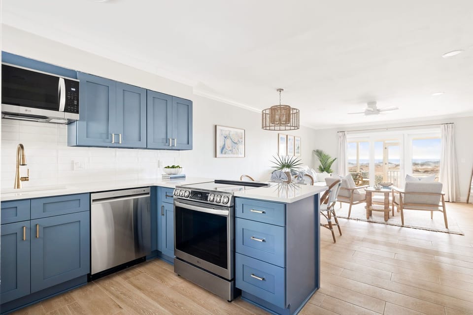 Cook breakfast together in the kitchen while watching the sunrise over the dunes
