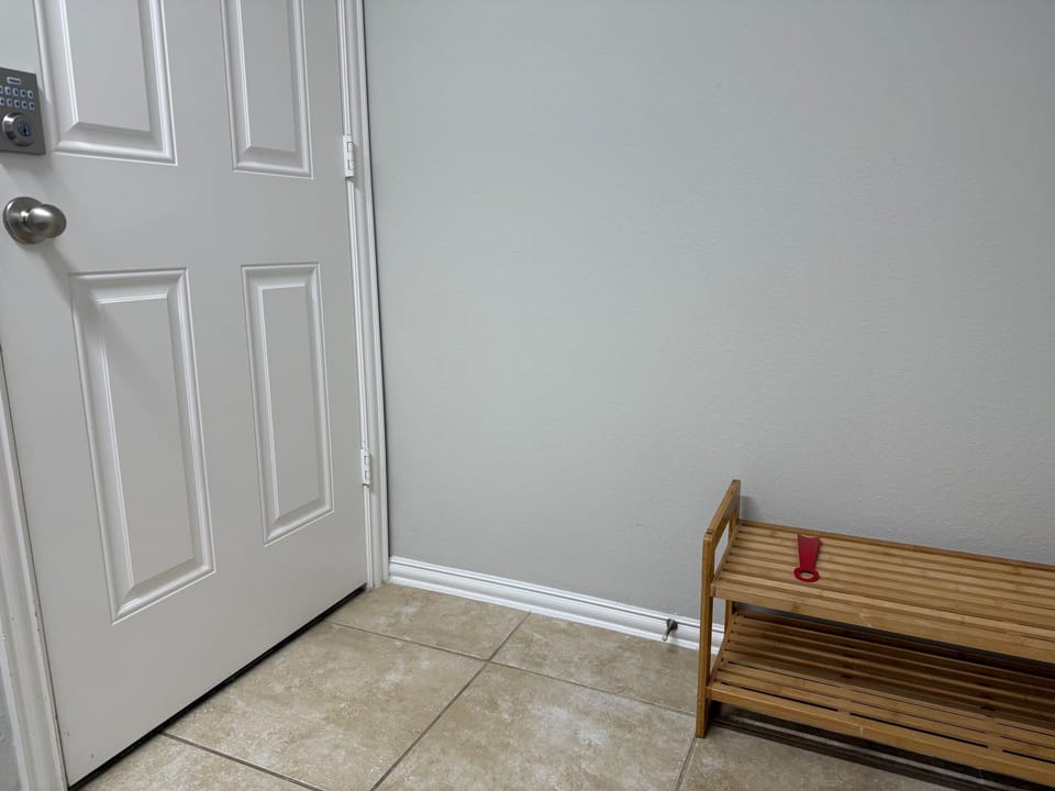 Entry area with shoe storage.