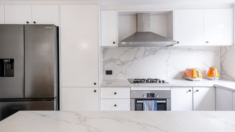Spacious kitchen with ample counter space.
