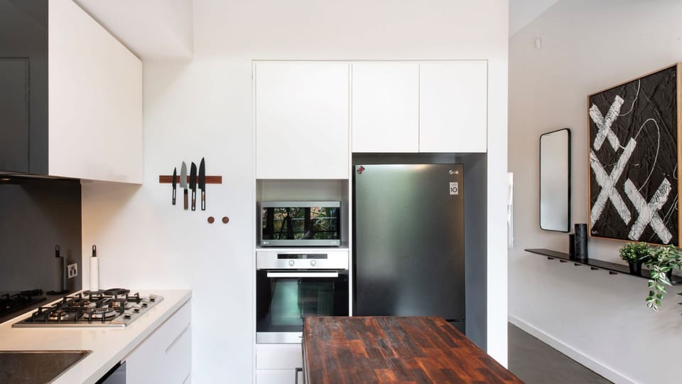 Gather around this rustic kitchen island — the heart of the home, perfect for meal prep or socializing.