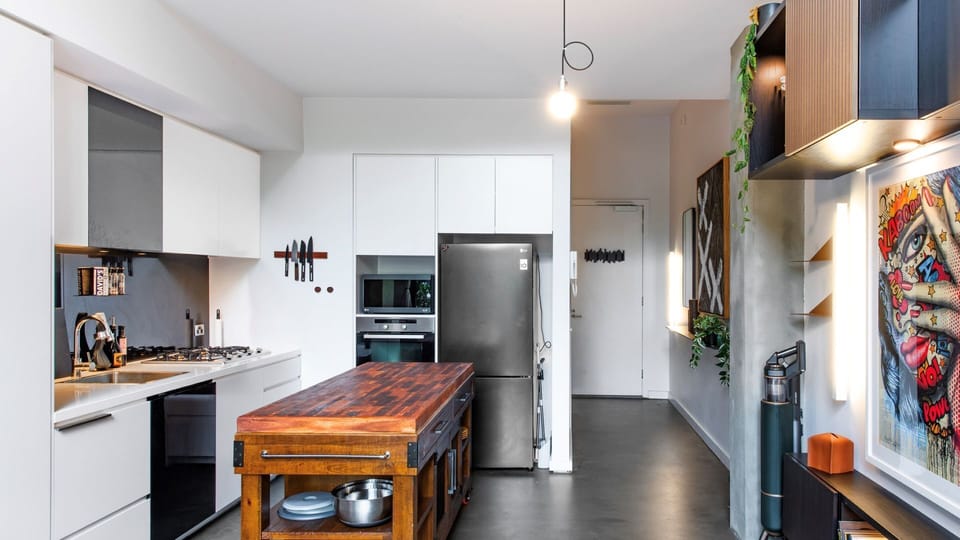 Whip up your favorite meals in this sleek, fully-equipped kitchen — perfect for foodies and home cooks alike!"