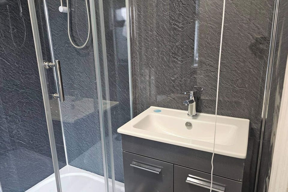 Our modern bathroom is designed to offer a refreshing start and a relaxing end to your day. Sparkling clean and well-maintained, it features a spacious shower, fresh towels, and essential toiletries provided for your convenience.
