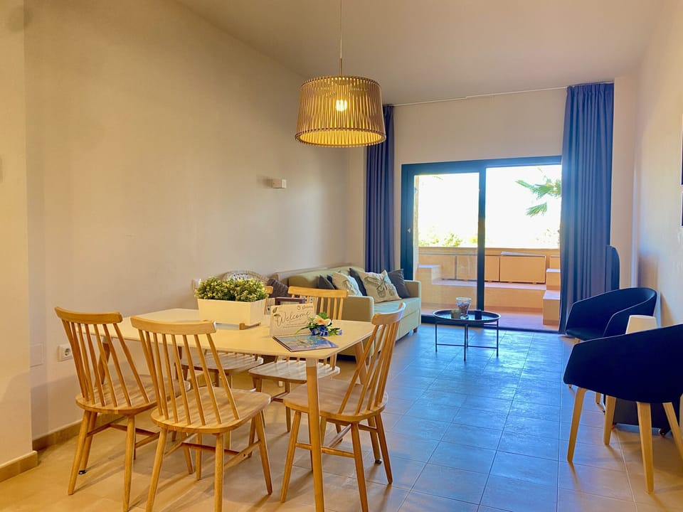 Bright and comfortable living-dining room with direct access to the terrace, perfect to enjoy a relaxed stay and easily connect the interior spaces with the exterior.