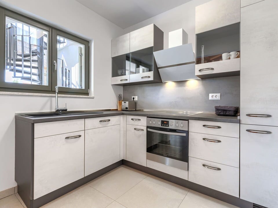 Kitchen, Cabinetry, Kitchen Appliance, Countertop, Major Appliance, Home Appliance, Interior Design, Drawer, Flooring, Cupboard