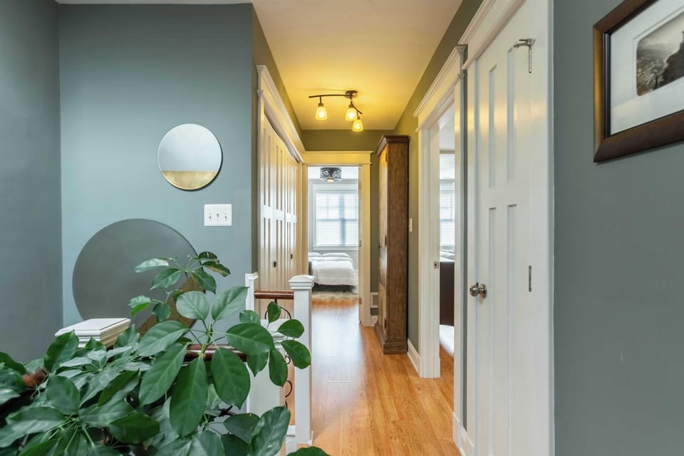 Upstairs hallway facing rear Primary BR, 3rd BR, and Laundry center