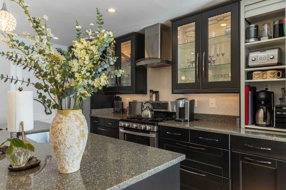 Gas range, well-equipped appliance garage, and coffee station