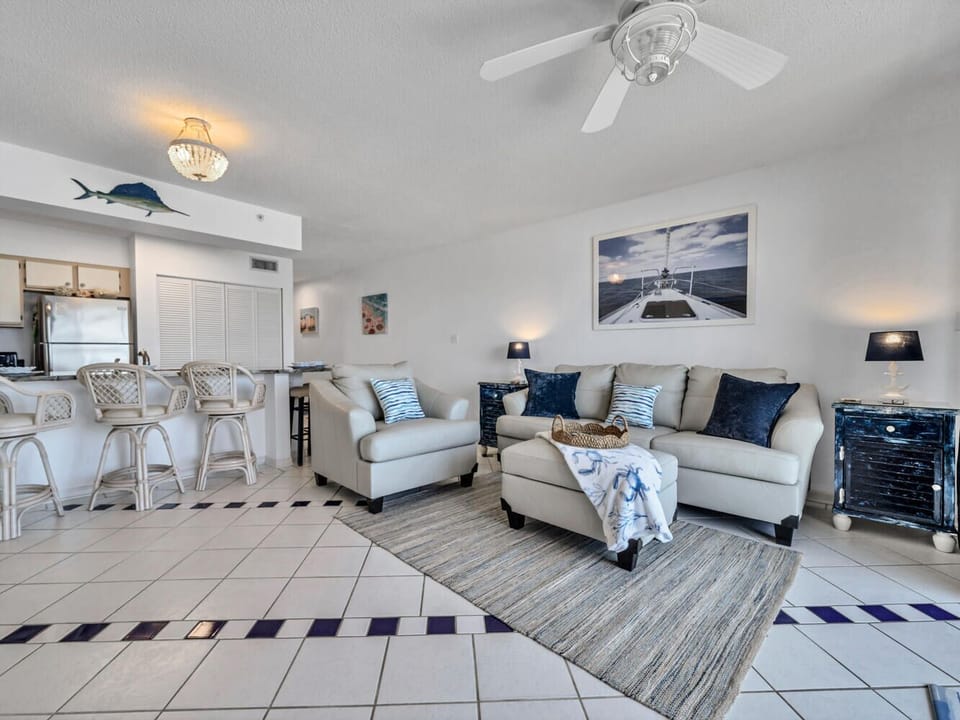 Relax in your bright coastal living space where nautical touches and plush seating create the perfect beachside retreat.