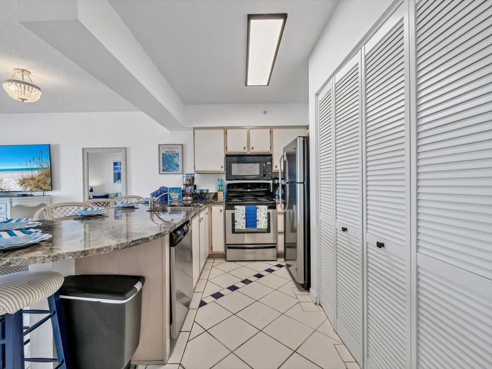 Your fully equipped kitchen awaits with granite counters, stainless appliances, and ample storage for preparing memorable meals.