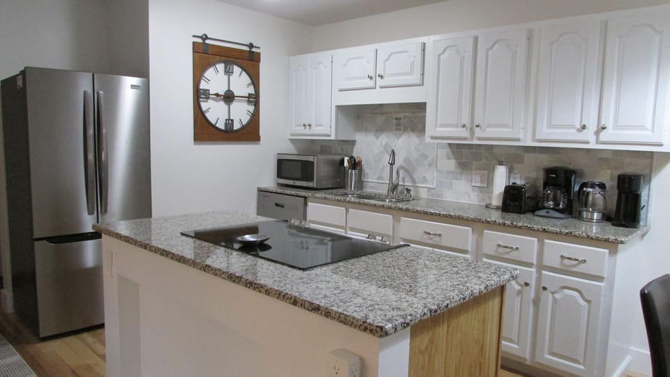 Full equipped kitchen with fridge, oven, and choice of coffee makers. 