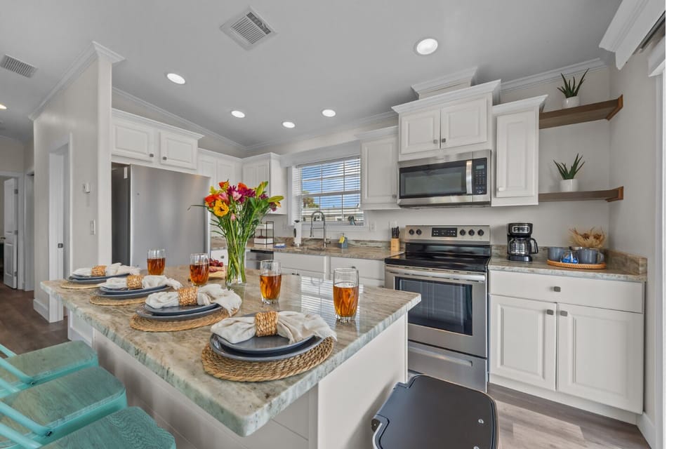Bright, modern kitchen with a spacious island—perfect for cooking, dining, and gathering with family and friends. 🍽️✨