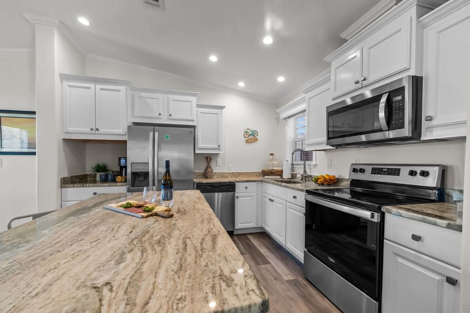 Gourmet Kitchen: Whip up culinary delights in this modern, sunlit kitchen with stylish finishes!