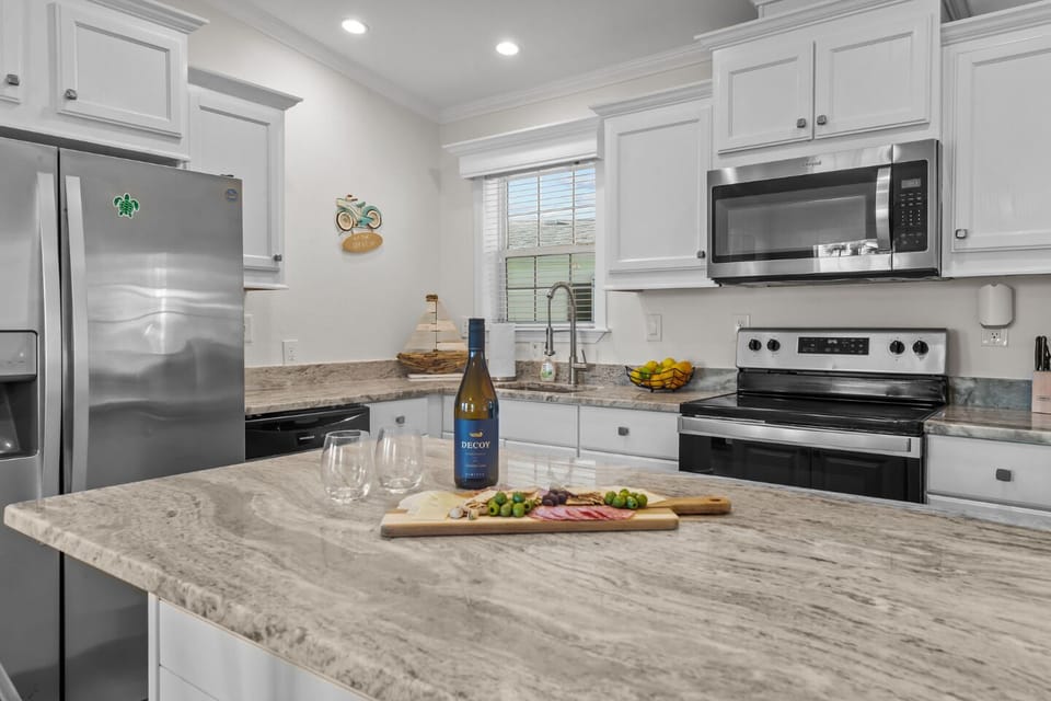 Modern appliances and a stylish island await your culinary adventures!