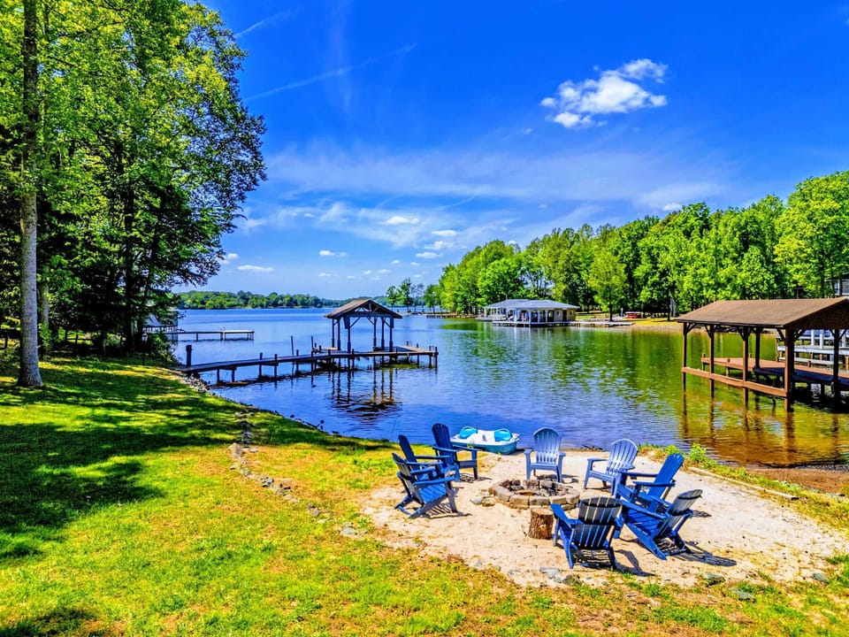 Waterfront Retreat – Comfortable Adirondack chairs set up for fireside storytelling.