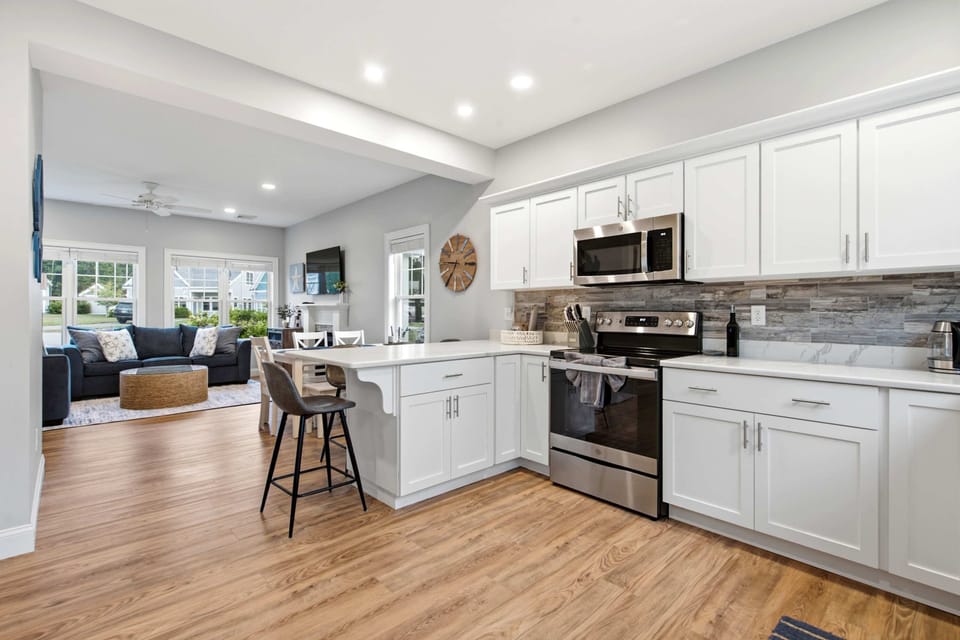 The airy kitchen offers ample space & all the comforts of home