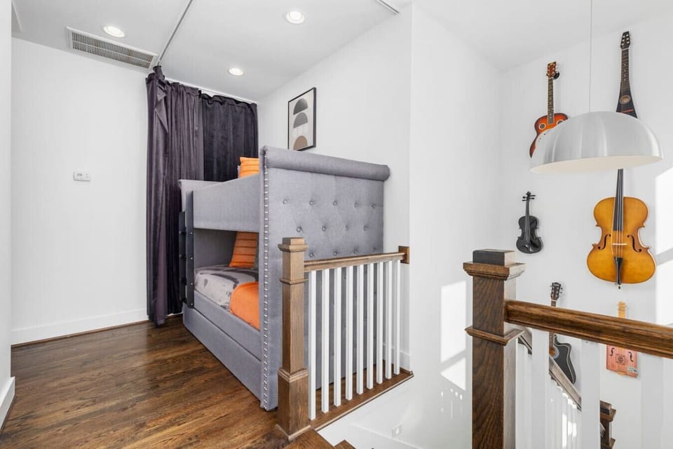 Unit A - Comfortable twin-over-twin bunk beds & a twin trundle bed with a retractable darkening shade to block out the light, at the top of the stairs.