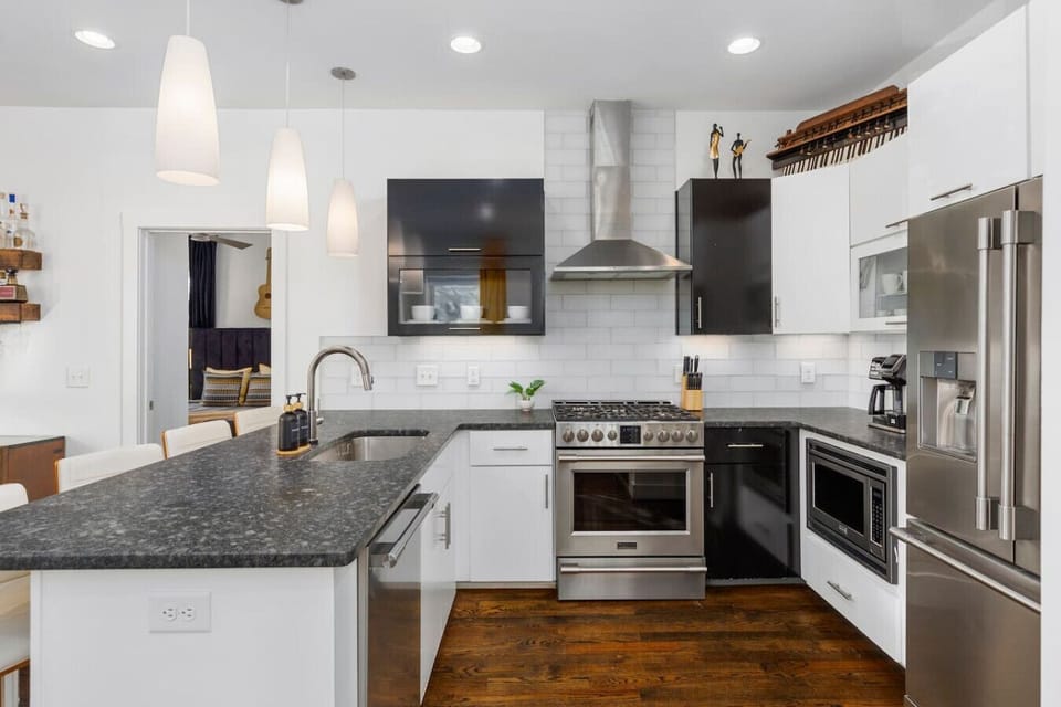 Unit A -  fully-stocked, updated kitchen with seating for 4 at the counter.