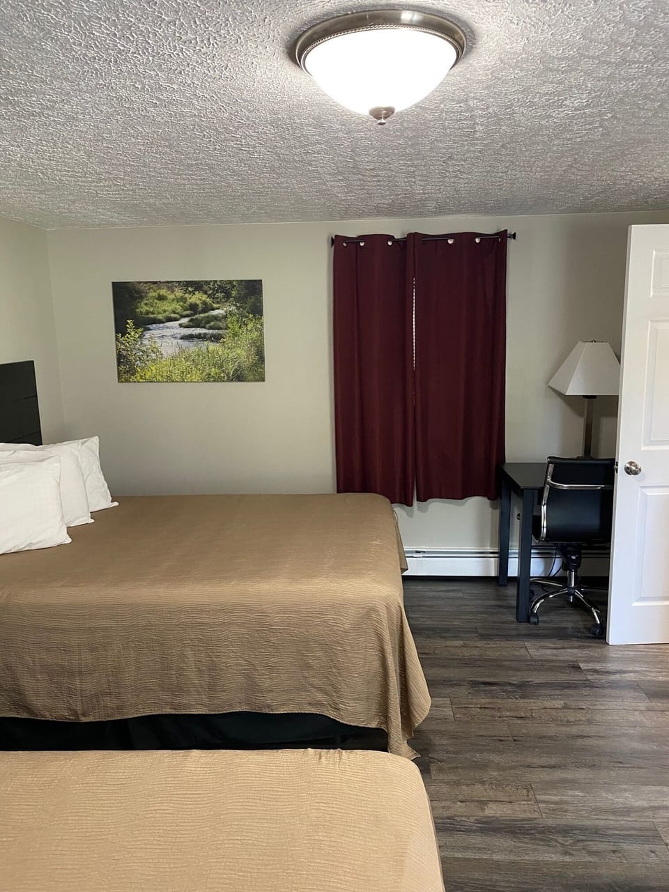 Desk, iron/ironing board, bed sheets