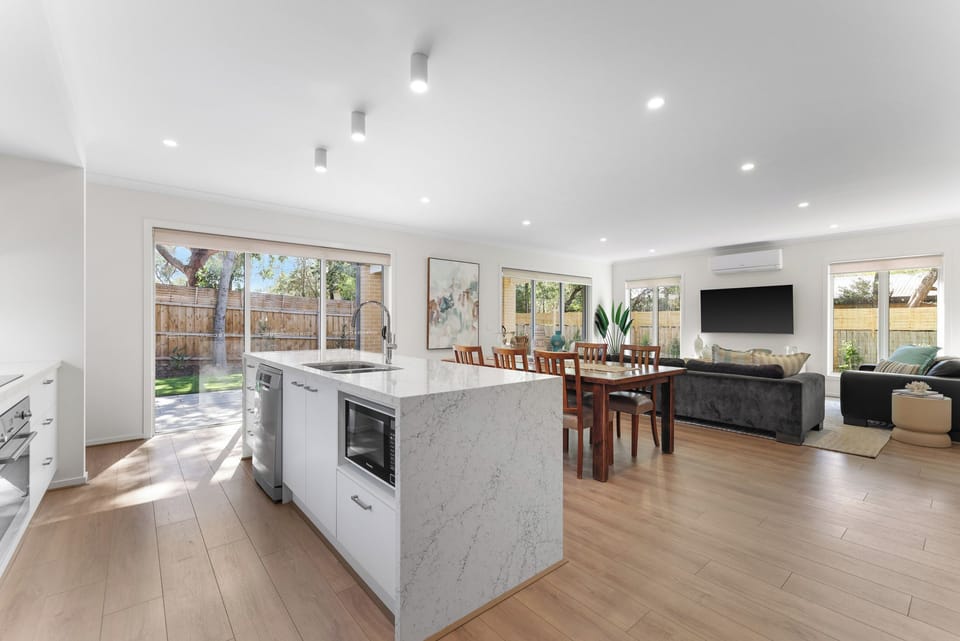 Stylish and seamlessly connected to the kitchen, creating a vibrant social hub.