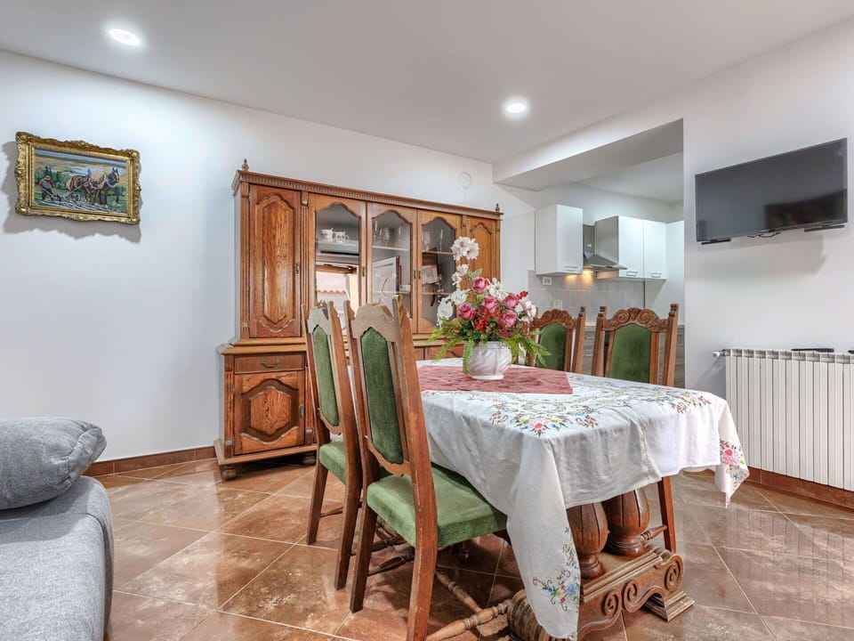 Furniture, Interior Design, Flooring, Wood, Ceiling, Floor, Room, Cabinetry, Table, Lighting